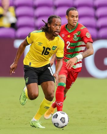 Jamaica midfielder DANIEL JOHNSON (16) attacks the ball during the 2021 Concacaf Gold Cup Jamaica vs Suriname soccer match at Exploria Stadium in Orlando, Fl on July 12, 2021.