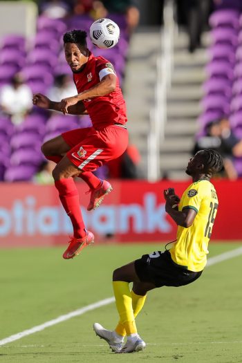 Guadeloupe defender MICKAEL ALPHONSE (12) gets a header during the 2021 Concacaf Gold Cup Guadeloupe vs Jamaica soccer match at Exploria Stadium in Orlando, Fl on July 16, 2021.