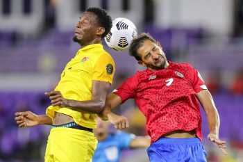 Guadeloupe midfielder MAVRICK ANNEROSE (7) gets a header against Costa Rica midfielder CELSO BORGES (5) during the 2021 Concacaf Gold Cup Costa Rica vs Guadeloupe soccer match at Exploria Stadium in Orlando, Fl on July 12, 2021.
