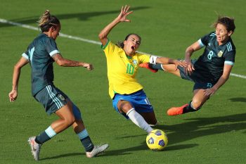 Brazil midfielder MARTA (10) competes for the ball against Argentina midfielder CLARISA HUBER (8) during the SheBelieves Cup Brazil vs Argentina match at Exploria Stadium in Orlando, Fl on February 18, 2021.