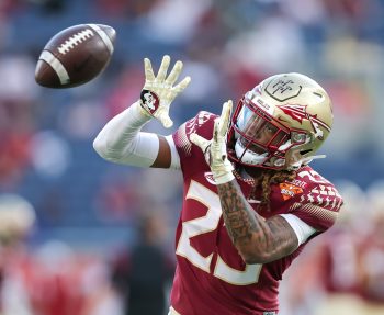 Florida State Seminoles defensive back SIDNEY WILLIAMS (23) makes a catch at warm ups during the 2022 NCAA Cheez-It Bowl game between the Florida State Seminoles and Oklahoma Sooners at Camping World Stadium  in Orlando, FL on December 29, 2022.