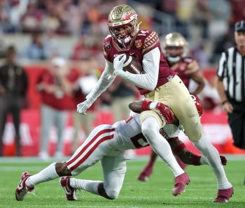 Florida State Seminoles wide receiver JOHNNY WILSON (14) runs with the ball after a reception during the 2022 NCAA Cheez-It Bowl game between the Florida State Seminoles and Oklahoma Sooners at Camping World Stadium  in Orlando, FL on December 29, 2022.