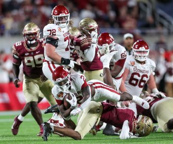 Oklahoma Sooners running back JOVANTAE BARNES (2) dives for yardage during the 2022 NCAA Cheez-It Bowl game between the Florida State Seminoles and Oklahoma Sooners at Camping World Stadium  in Orlando, FL on December 29, 2022.