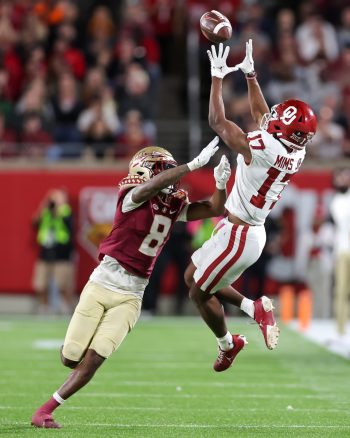 Oklahoma Sooners wide receiver MARVIN MIMS JR. (17) leaps for a catch during the 2022 NCAA Cheez-It Bowl game between the Florida State Seminoles and Oklahoma Sooners at Camping World Stadium  in Orlando, FL on December 29, 2022.