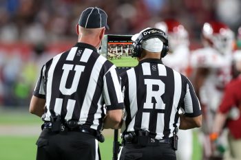 Game officials review a play during the 2022 NCAA Cheez-It Bowl game between the Florida State Seminoles and Oklahoma Sooners at Camping World Stadium  in Orlando, FL on December 29, 2022.