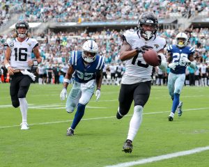 Jacksonville Jaguars wide receiver CHRISTIAN KIRK (13) runs the ball in for a touch down during the Jacksonville Jaquars vs Indianapolis Colts NFL game at TIAA Bank Field Stadium in Jacksonville, Fl on September 18, 2022.