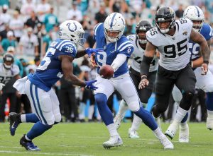 Indianapolis Colts quarterback NICK FOLES (9) hands off the ball to Indianapolis Colts running back DEON JACKSON (35) during the Jacksonville Jaquars vs Indianapolis Colts NFL game at TIAA Bank Field Stadium in Jacksonville, Fl on September 18, 2022.