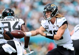Jacksonville Jaguars quarterback TREVOR LAWRENCE (16) hands off the ball during the Jacksonville Jaquars vs Indianapolis Colts NFL game at TIAA Bank Field Stadium in Jacksonville, Fl on September 18, 2022.