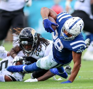 Indianapolis Colts running back JONATHAN TAYLOR (28) gets tackled during the Jacksonville Jaquars vs Indianapolis Colts NFL game at TIAA Bank Field Stadium in Jacksonville, Fl on September 18, 2022.