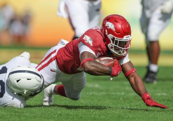 Arkansas Razorbacks running back RAHEIM SANDERS (5) gets tackled by Penn State Nittany Lions safety JI'AYIR BROWN (16) during the Outback Bowl at Raymond James Stadium in Tampa, FL on January 1, 2022.