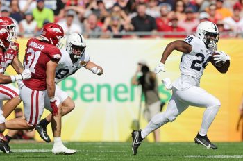 Penn State Nittany Lions running back KEYVONE LEE (24) runs the ball during the Outback Bowl at Raymond James Stadium in Tampa, FL on January 1, 2022.