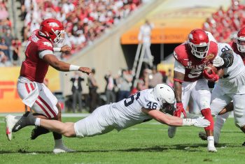 Arkansas Razorbacks running back RAHEIM SANDERS (5) gets tackled by Penn State Nittany Lions defensive end NICK TARBURTON (46) during the Outback Bowl at Raymond James Stadium in Tampa, FL on January 1, 2022.