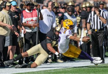 LSU Tigers quarterback JAYDEN DANIELS (5) gets pushed out of bounds during the 2023 NCAA Cheez-It Citrus Bowl game between the LSU Fighting Tigers and the Purdue Boilermakers at Camping World Stadium in Orlando, FL on January 2, 2023.