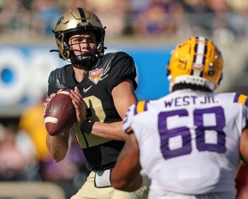 Purdue Boilermakers quarterback AUSTIN BURTON (12) prepares the pass the ball during the 2023 NCAA Cheez-It Citrus Bowl game between the LSU Fighting Tigers and the Purdue Boilermakers at Camping World Stadium in Orlando, FL on January 2, 2023.