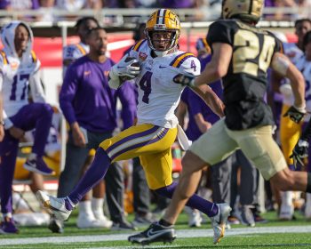 LSU Tigers running back JOHN EMERY JR. (4) runs down the sideline during the 2023 NCAA Cheez-It Citrus Bowl game between the LSU Fighting Tigers and the Purdue Boilermakers at Camping World Stadium in Orlando, FL on January 2, 2023.