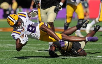 LSU Tigers wide receiver MALIK NABERS (8) gets tackled during the 2023 NCAA Cheez-It Citrus Bowl game between the LSU Fighting Tigers and the Purdue Boilermakers at Camping World Stadium in Orlando, FL on January 2, 2023.