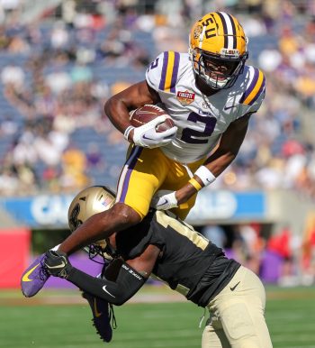LSU Tigers wide receiver KYREN LACY (2) leaps over a defender during the 2023 NCAA Cheez-It Citrus Bowl game between the LSU Fighting Tigers and the Purdue Boilermakers at Camping World Stadium in Orlando, FL on January 2, 2023.