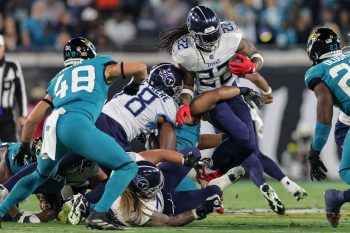 Tennessee Titans running back DERRICK HENRY (22) runs up the middle during the Jacksonville Jaguars vs Tennessee Titans NFL game at TIAA Bank Field Stadium in Jacksonville, Fl on January 7, 2023.