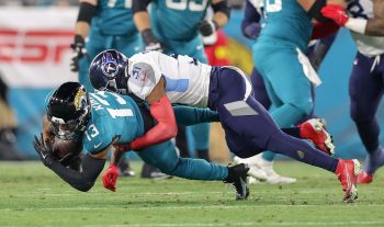Jacksonville Jaguars wide receiver CHRISTIAN KIRK (13) gets tackled during the Jacksonville Jaguars vs Tennessee Titans NFL game at TIAA Bank Field Stadium in Jacksonville, Fl on January 7, 2023.