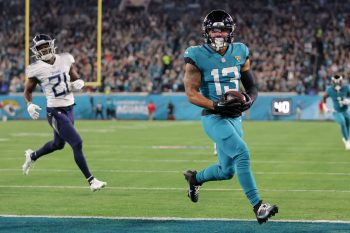 Jacksonville Jaguars wide receiver CHRISTIAN KIRK (13) runs the ball in for a touchdown during the Jacksonville Jaguars vs Tennessee Titans NFL game at TIAA Bank Field Stadium in Jacksonville, Fl on January 7, 2023.