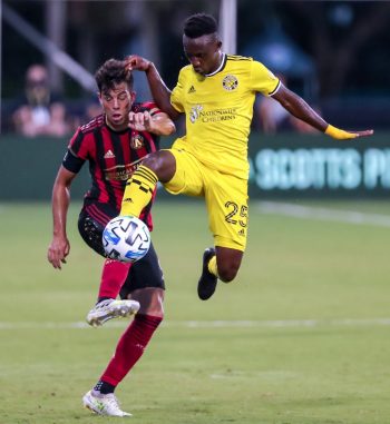 Columbus Crew defender HARRISON AFFUL (25) connects with the ball against Atlanta United defender FERNANDO MEZA (6) during the MLS is Back Tournament Atlanta United vs Columbus Crew SC match at ESPN Wide World of Sports Complex in Orlando, Fl on July 21, 2020.