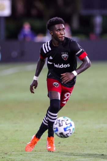 D.C. United midfielder ONIEL FISHER (91) sets up a pass during the MLS is Back Tournament D.C. United vs New England Revolution match at ESPN Wide World of Sports Complex in Orlando, Fl on July 17, 2020.