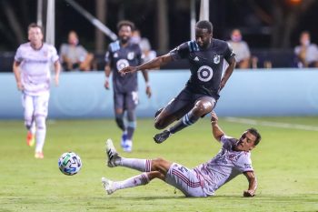 Minnesota United midfielder KEVIN MOLINO (7) leaps over Real Salt Lake defender DONNY TOIA (4) during the MLS is Back Tournament Real Salt Lake vs Minnesota United match at ESPN Wide World of Sports Complex in Orlando, Fl on July 17, 2020.