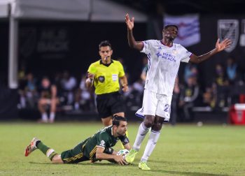 FC Cincinnati midfielder FATAI ALASHE (27) waves off a penalty call against Portland Timbers midfielder DIEGO VALERI (8) during the MLS is Back Tournament Portland Timbers vs FC Cincinnati match at ESPN Wide World of Sports Complex in Orlando, Fl on July 28, 2020.