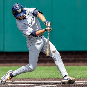 May 11, 2024; Asheboro, NC, USA; Wingate University infielder Jake Courville (38) makes a base hit against Lincoln Memorial University during the SAC Baseball Tournament at McCrary Park. Mandatory Credit: Cory Knowlton-USA TODAY Sports