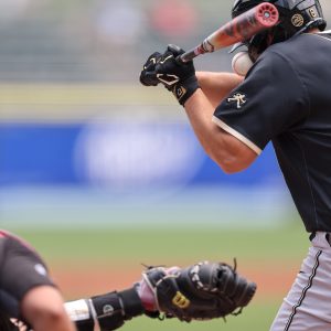 May 25, 2024; Charlotte, NC, USA; Wake Forest first baseman Nick Kurtz (8) gets hit with the ball in the first inning against Florida State during the ACC Baseball Tournament at Truist Field. Mandatory Credit: Cory Knowlton-USA TODAY Sports