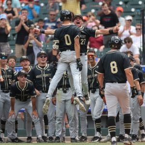 May 25, 2024; Charlotte, NC, USA; Wake Forest catcher Tate Ballestero (0) and Wake Forest catcher Cameron Gill (27) celebrate after hitting a home run in the fourth inning agains Florida State during the ACC Baseball Tournament at Truist Field. Mandatory Credit: Cory Knowlton-USA TODAY Sports