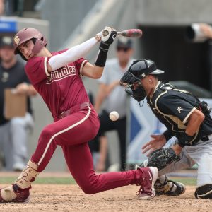 May 25, 2024; Charlotte, NC, USA; Florida State infielder Alex Lodise (1) hits a foul ball in the sixth inning agains Wake Forest during the ACC Baseball Tournament at Truist Field. Mandatory Credit: Cory Knowlton-USA TODAY Sports