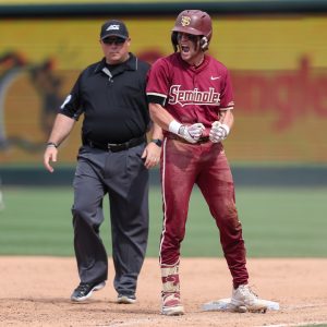May 25, 2024; Charlotte, NC, USA; Florida State catcher Jaxson West (20) reacts after sliding into first base agains Wake Forest during the ACC Baseball Tournament at Truist Field. Mandatory Credit: Cory Knowlton-USA TODAY Sports