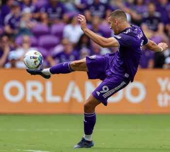 Orlando City forward ERCAN KARA (9) drives a kick during the MLS Orlando City vs Chicago Fire soccer match at Exploria Stadium in Orlando, FL on April 9, 2022.