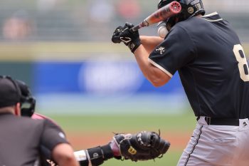 May 25, 2024; Charlotte, NC, USA; Wake Forest first baseman Nick Kurtz (8) gets hit with the ball in the first inning against Florida State during the ACC Baseball Tournament at Truist Field. Mandatory Credit: Cory Knowlton-USA TODAY Sports