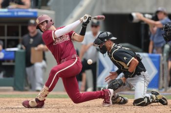 May 25, 2024; Charlotte, NC, USA; Florida State infielder Alex Lodise (1) hits a foul ball in the sixth inning agains Wake Forest during the ACC Baseball Tournament at Truist Field. Mandatory Credit: Cory Knowlton-USA TODAY Sports
