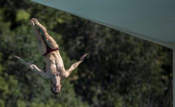A diver dives off the 10 meter platform during a practice session at the Rose Bowl Aquatic center on Thursday, April 25, 2019.