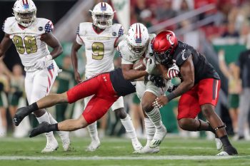 Tampa, FL - November 12: South Florida Bulls running back Jaren Mangham (0) breaks a tackle during a college football game between South Florida Bulls and Cincinnati Bearcats played on November 12, 2021 at Raymond James Stadium in Tampa, FL. (Photo credit: Cory Knowlton/Sportscene Media)