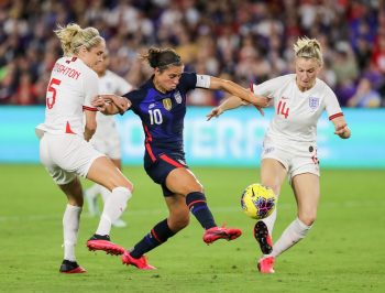 United States forward CARLI LLOYD (10) competes for the ball against England defender STEPH HOUGHTON (5) and England defender LEAH WILLIAMSON (14) during the SheBelieves Cup United States vs England match at Exploria Stadium in Orlando, Fl on March 5, 2020.
