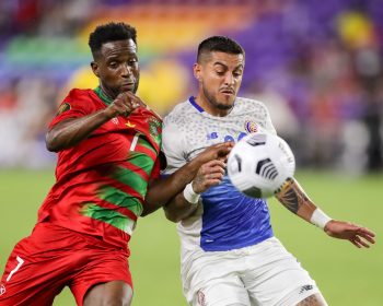 Suriname forward MARC JOZEFZOON (7) competes for the ball against Costa Rica defender RONALD MATARRITA (22) during the 2021 Concacaf Gold Cup Suriname vs Costa Rica soccer match at Exploria Stadium in Orlando, Fl on July 16, 2021.